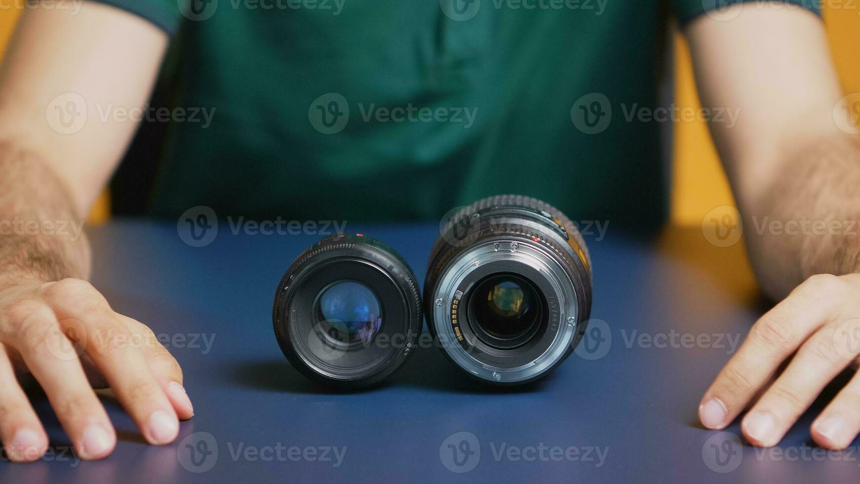Close up of camera lenses while photographer records vlog. Camera lens technology digital recording social media influencer content creator, professional studio for podcast, vlogging and blogging photo