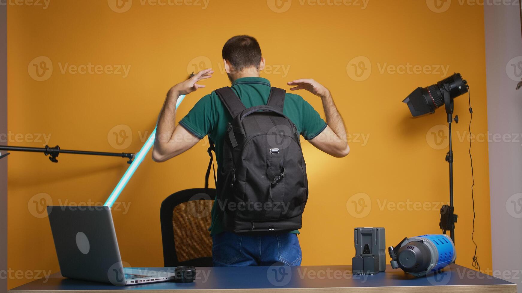 Photographer recording testimonial about dslr backpack for vlog and subscribers. Professional studio video and photo equipment technology for work, photo studio social media star and influencer