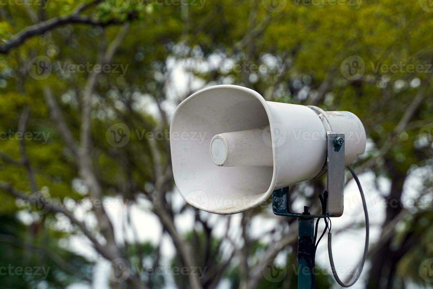 Loudspeakers mounted on steel poles are installed at various points around tourist attractions to promote news to tourists. Soft and selective focus. photo