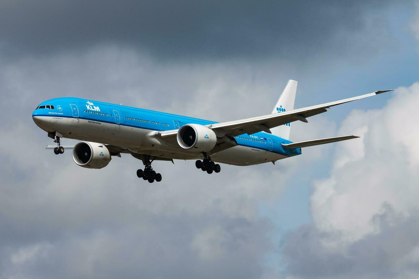 Amsterdam, Netherlands, 2014 - KLM Royal Dutch Airlines Boeing 777-300ER PH-BVI passenger plane arrival and landing at Amsterdam Schipol Airport photo