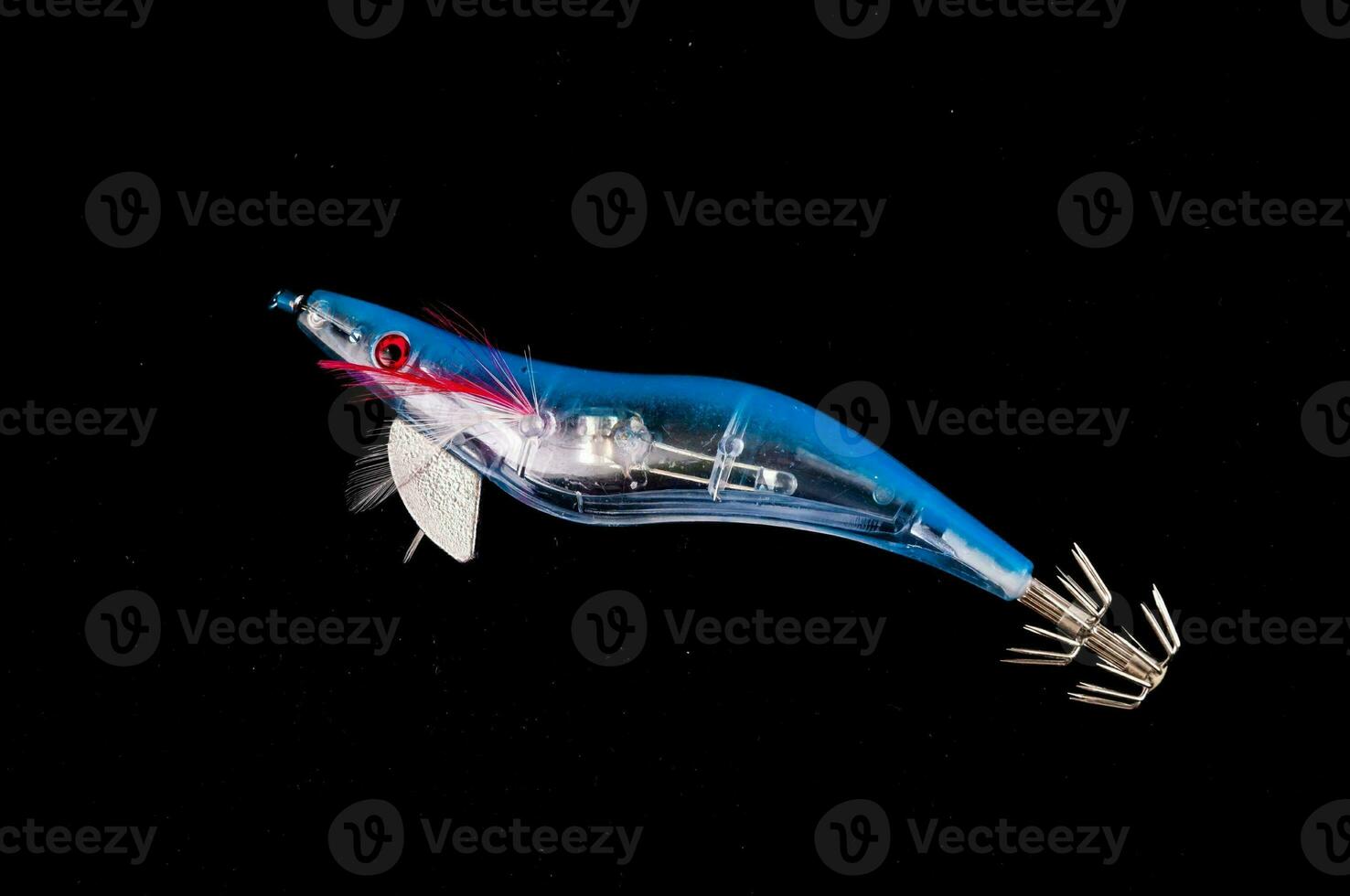 a blue, white and red plastic fishing lure photo