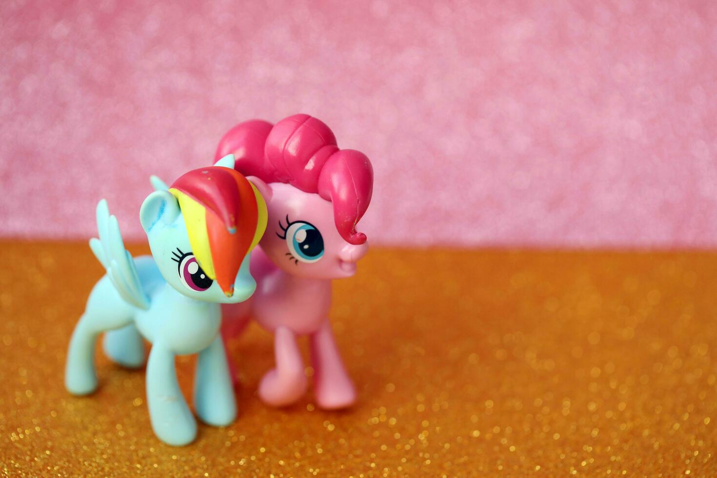 TERNOPIL, UKRAINE - JULY 7, 2023 Old toy with character from My Little Pony MLP cartoon TV show on bright shiny glitter background photo