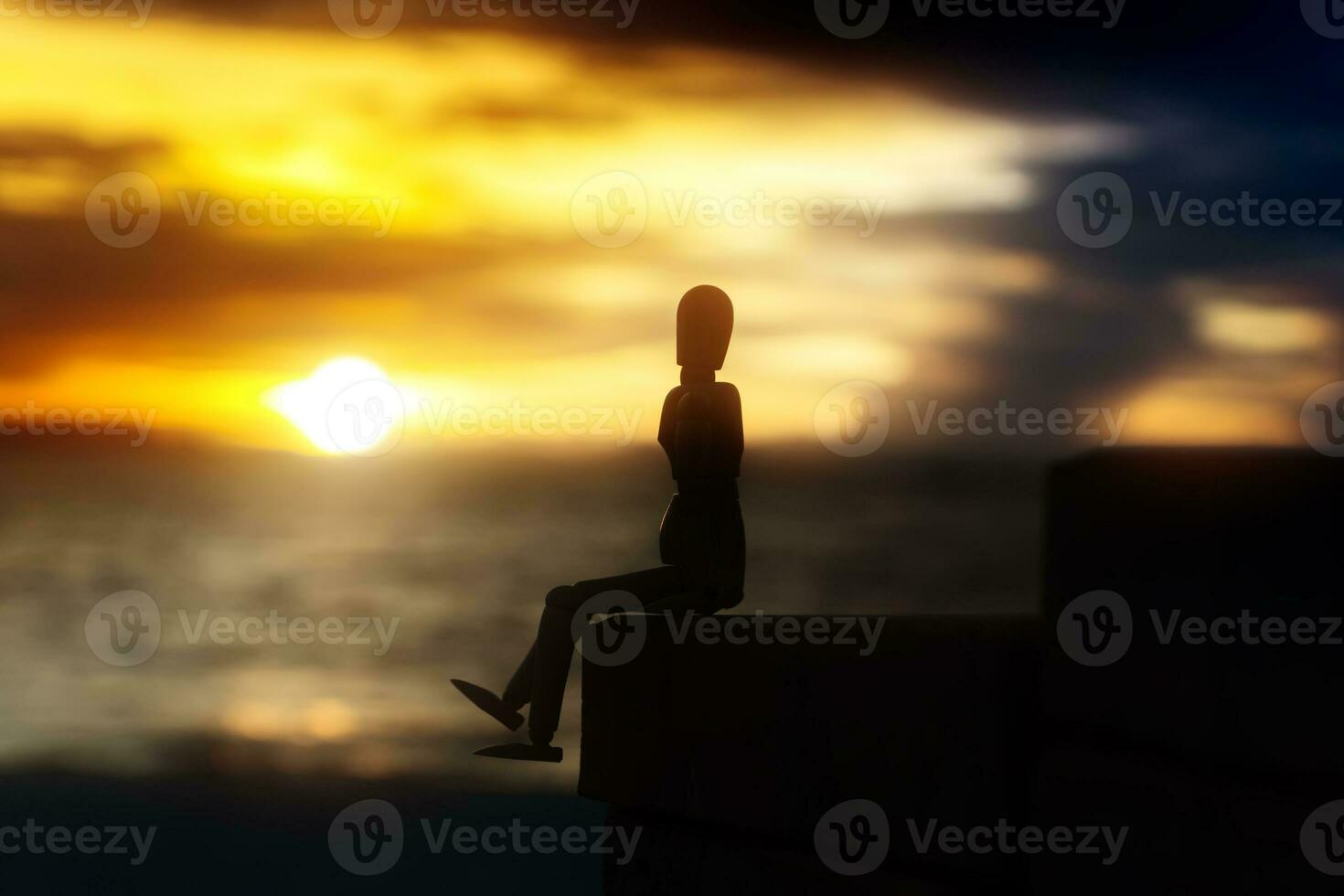 Silhouettes of wooden models feel lonely at sunset. photo