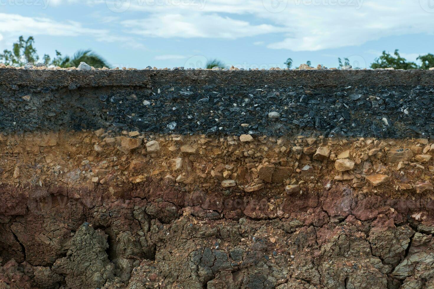 The layer of asphalt with soil and rock. photo
