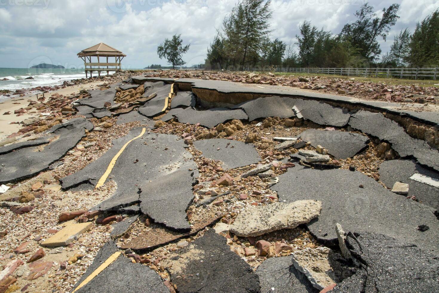 Road erosion caused by waves and severe storms. photo