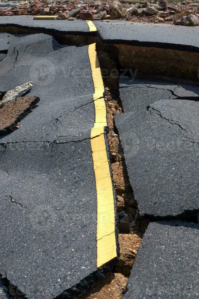 Road erosion caused by waves and severe storms. photo