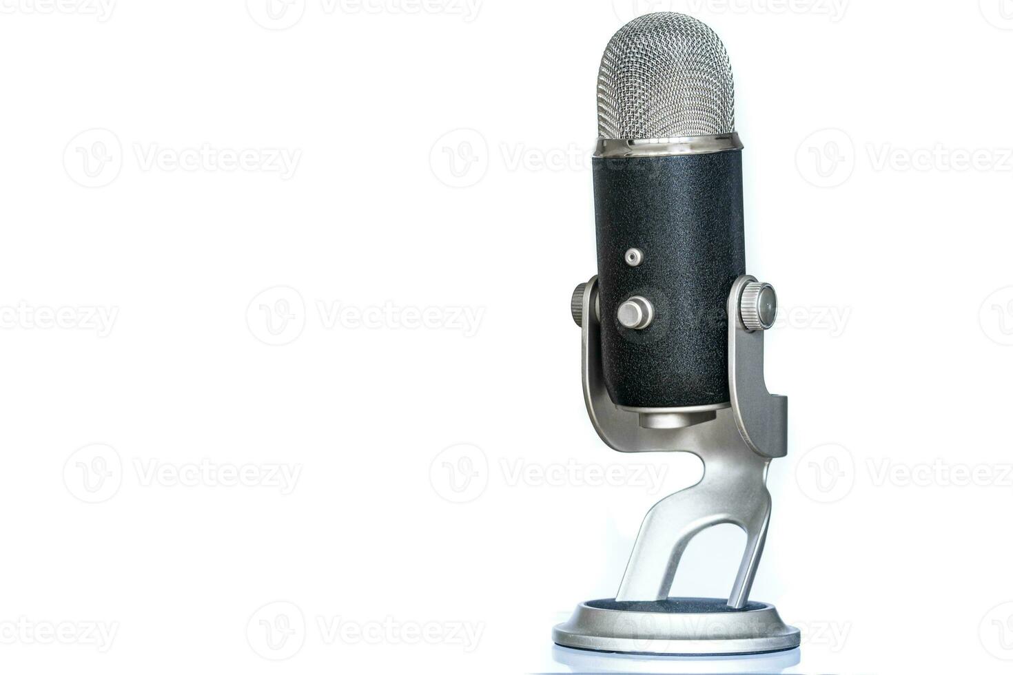Microphone with classic and vintage look standing up. Used for podcasting or other voice recording. photo