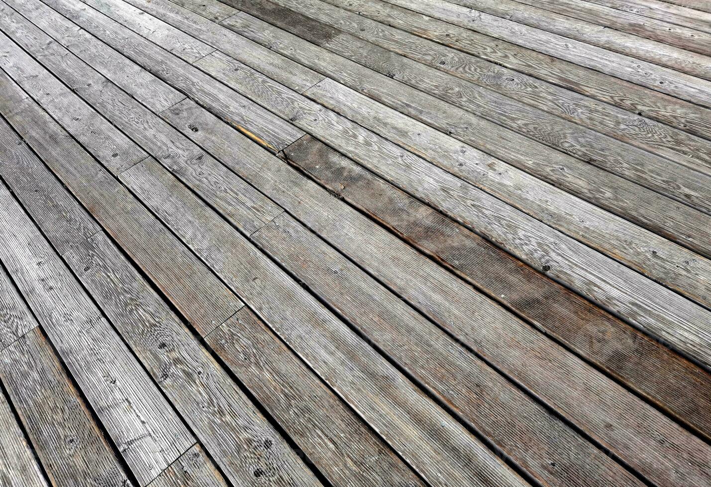 Natural grey surface from wood boards. Decking tiles. Horizontal view photo