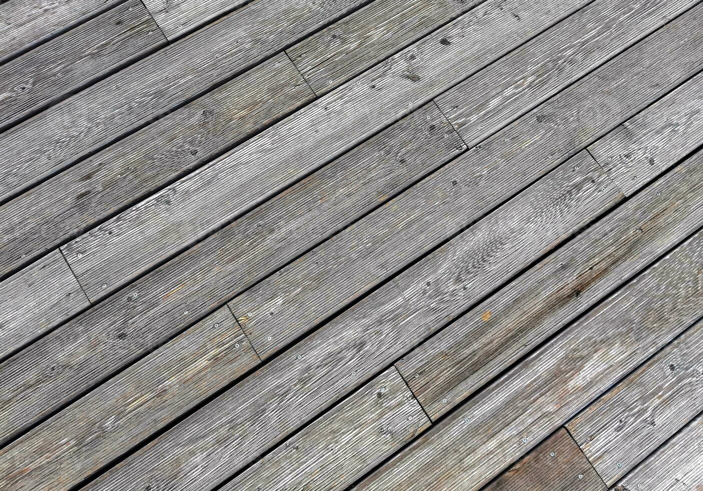 Natural grey surface from wood boards. Decking tiles. Horizontal view photo
