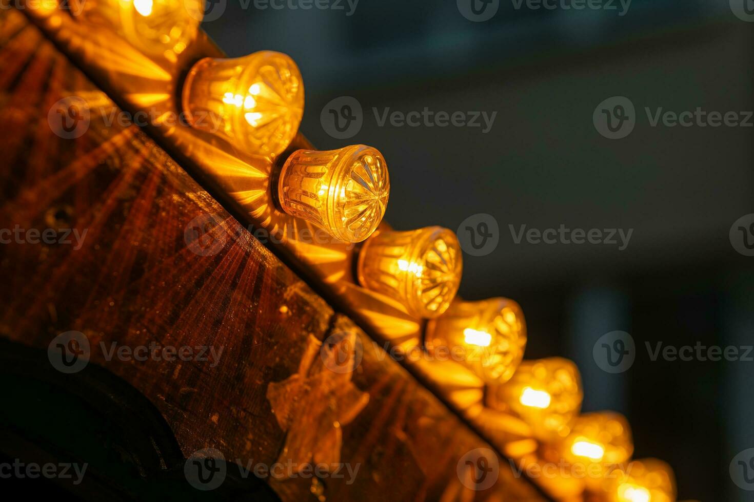 festive lighting on a wooden ceiling photo