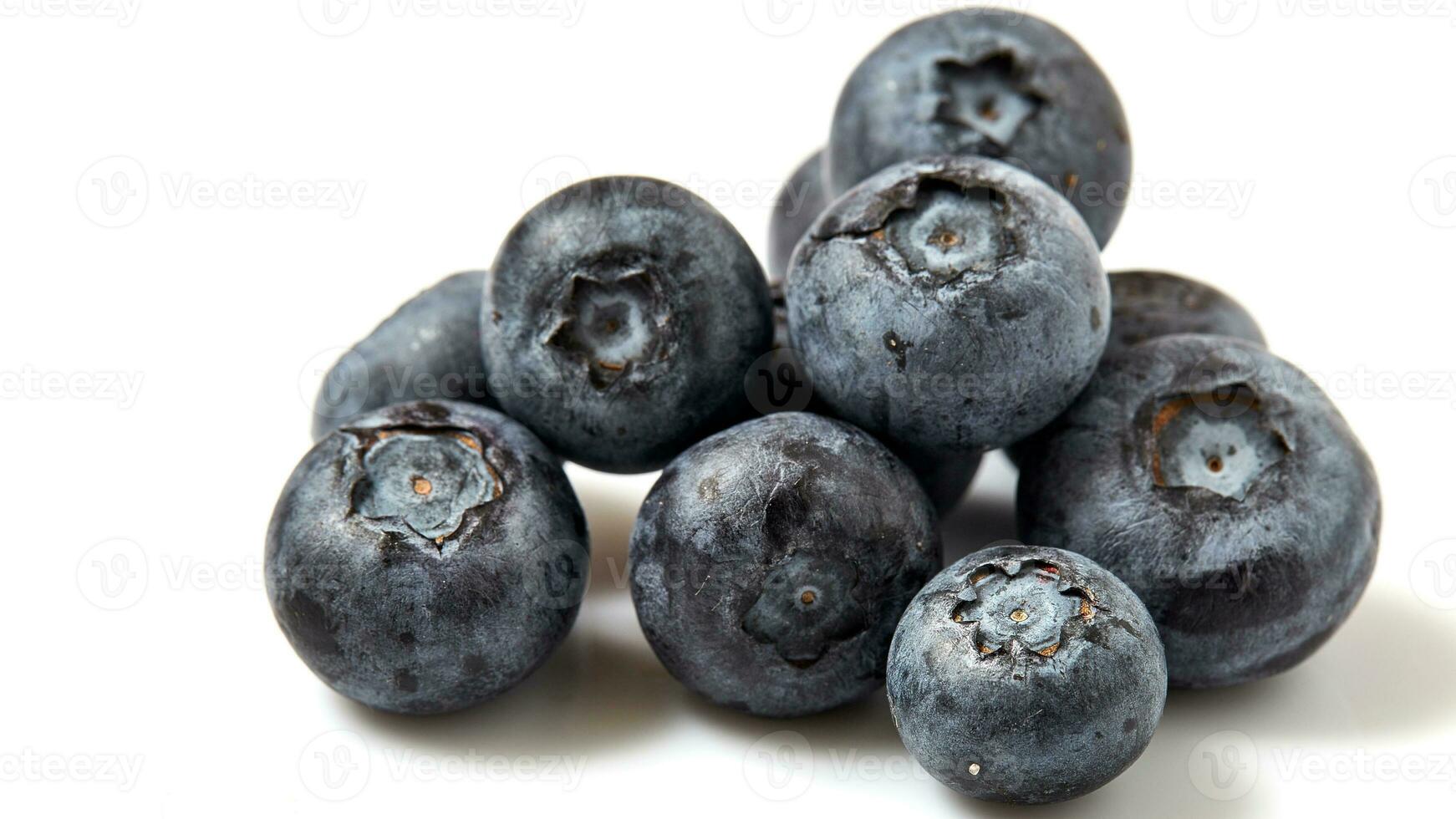 Fresh Blueberries. Organic, Juicy and Nutritious Fruit Isolated on White Background. Healthy Snacks Concept and Antioxidant-Rich Nutrition photo