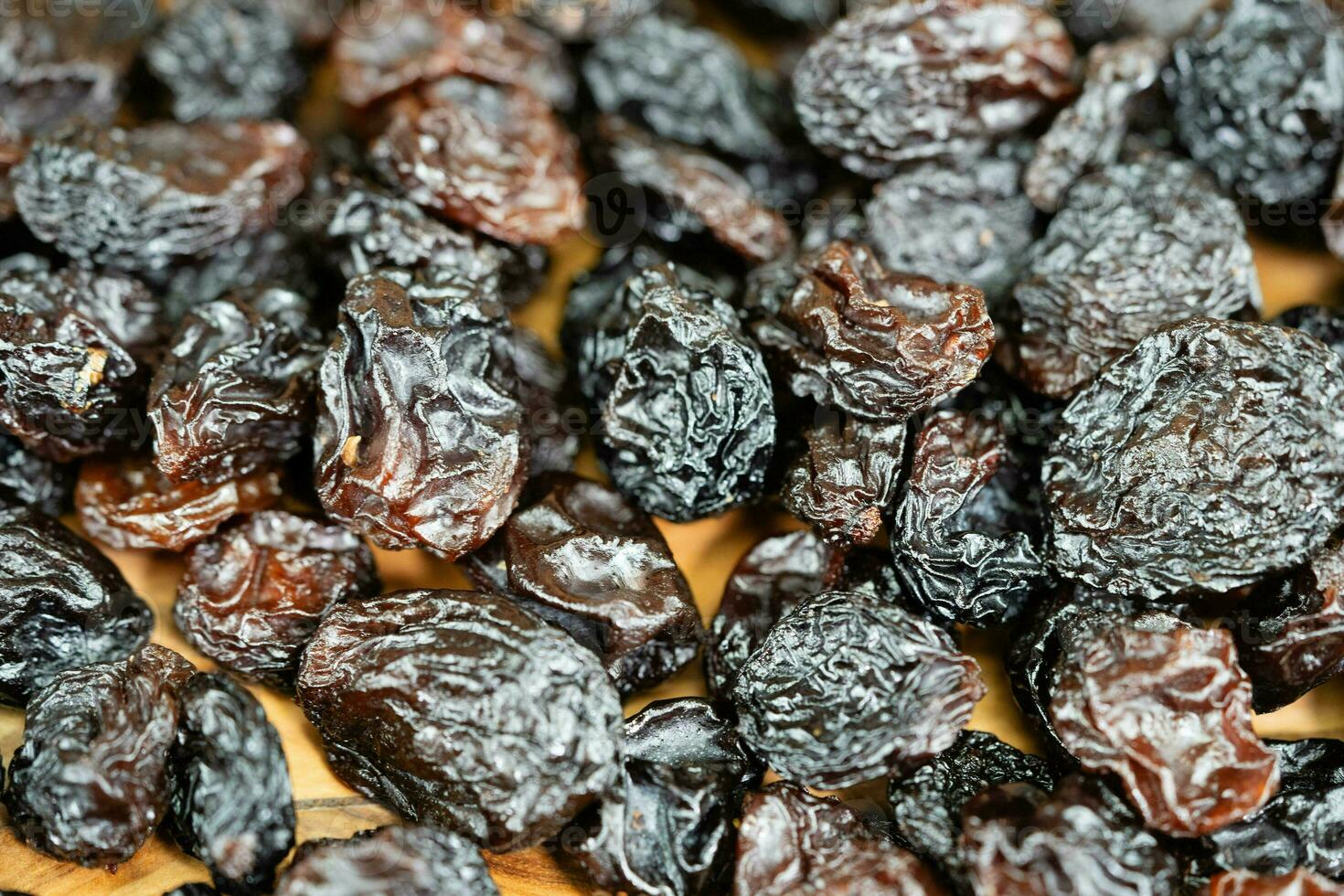 wine grapes raisins and wine berries on olive wood photo