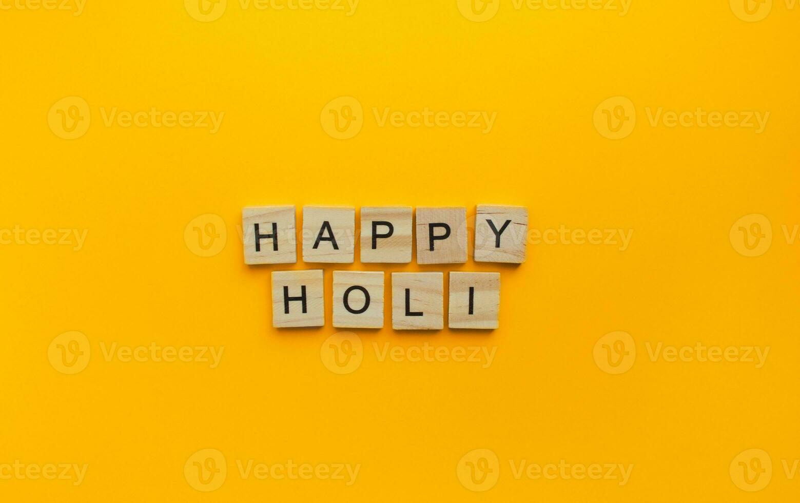 On March 8, Holi is a celebration of spring and bright colors in India, a minimalistic banner with an inscription in wooden letters photo