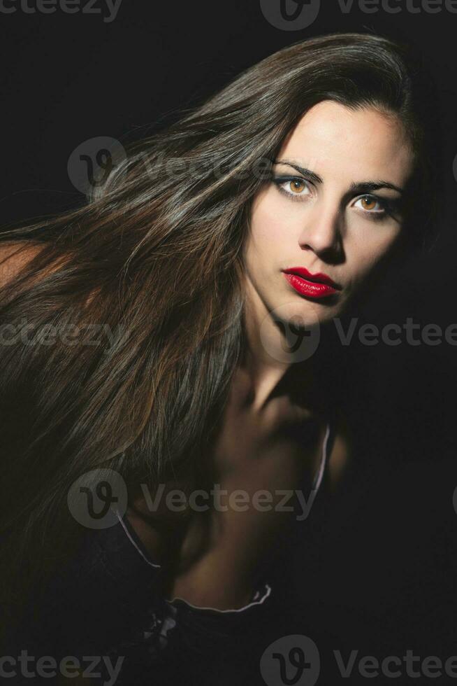 Portrait of young woman with long hair photo