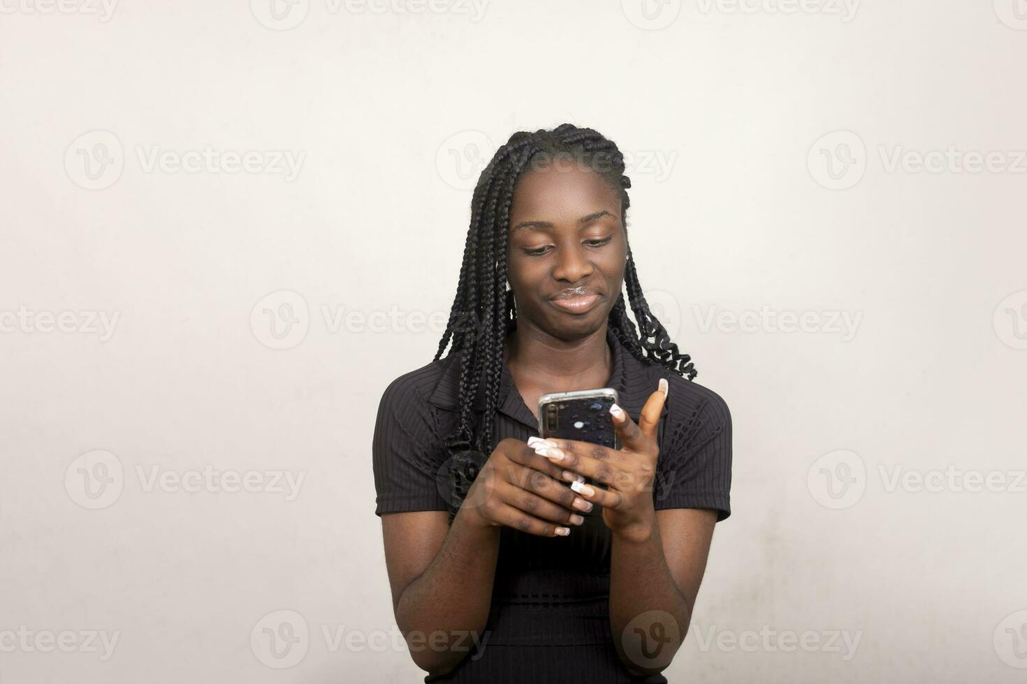 African lady using her cellphone excited photo