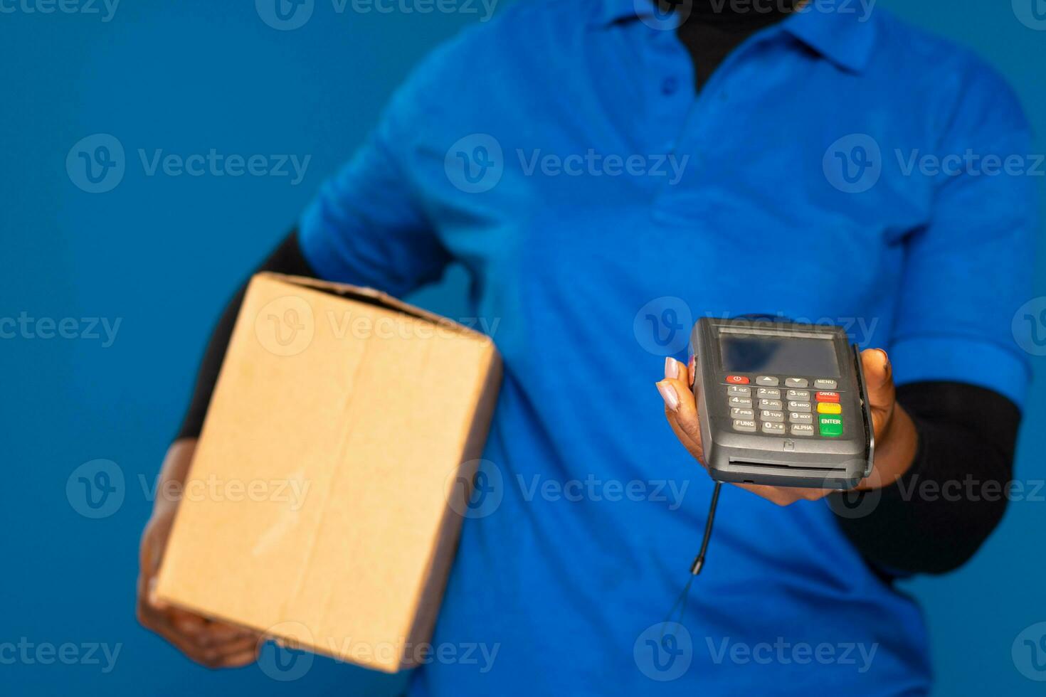 delivery worker holding a point of sale device photo