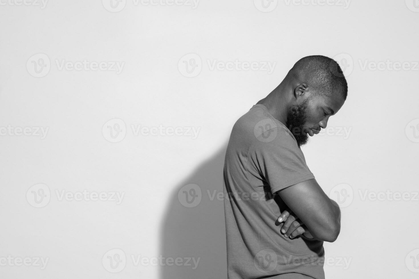 young black man having mental struggle, looking sad and unhappy photo