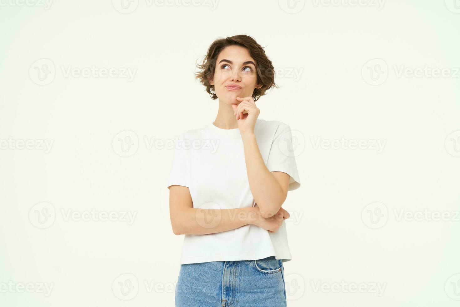 Image of girl thinking, making thoughtful face, making decision, choosing, standing over white studio background photo