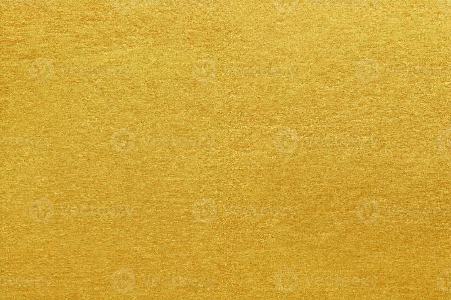 Shiny yellow leaf gold foil texture background photo