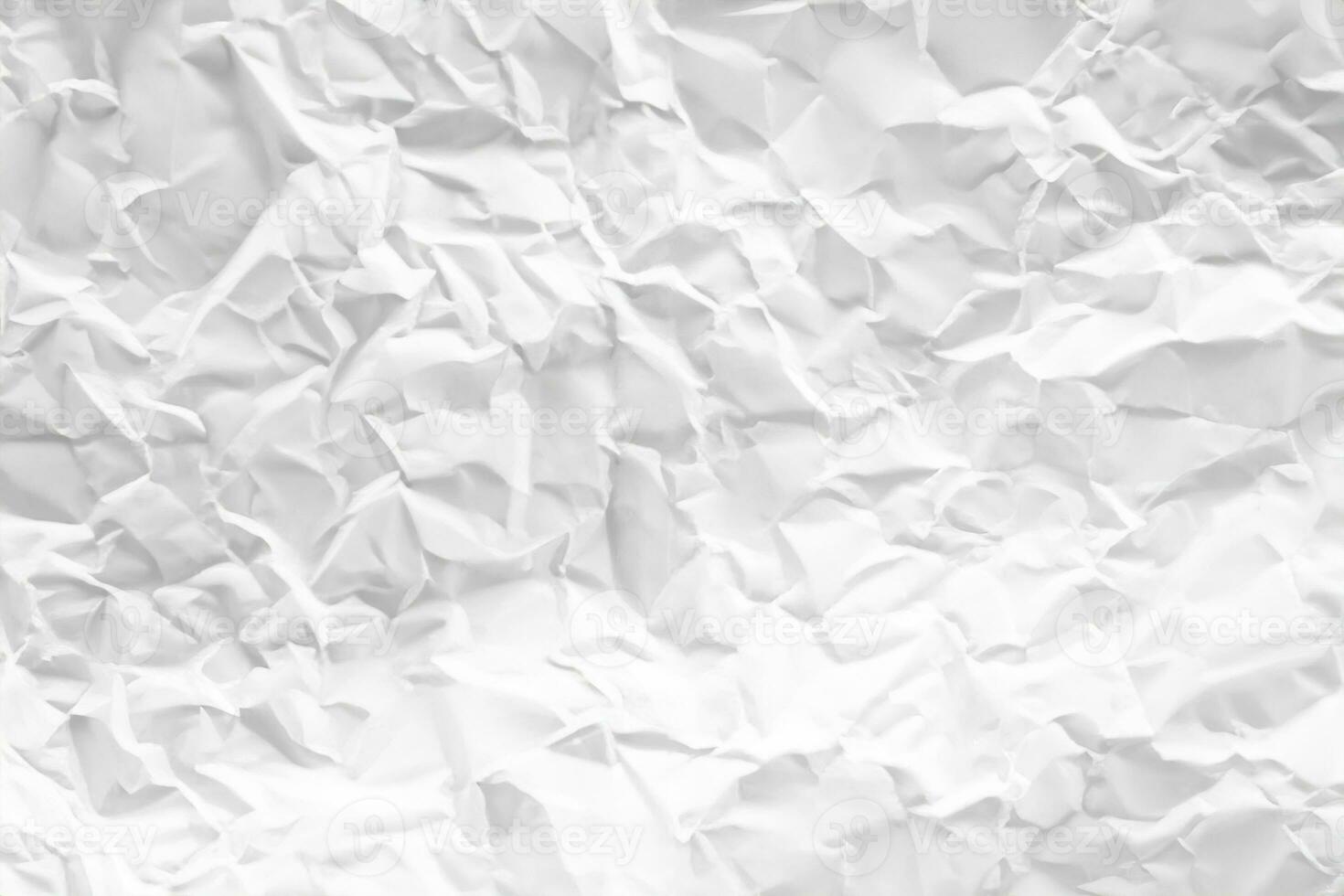 white and gray crumpled paper texture background. crush paper so that it becomes creased and wrinkled. photo