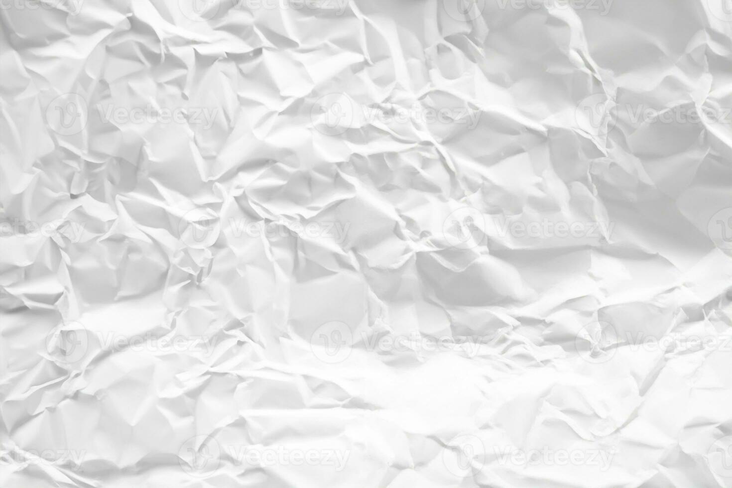 white and gray crumpled paper texture background. crush paper so that it becomes creased and wrinkled. photo