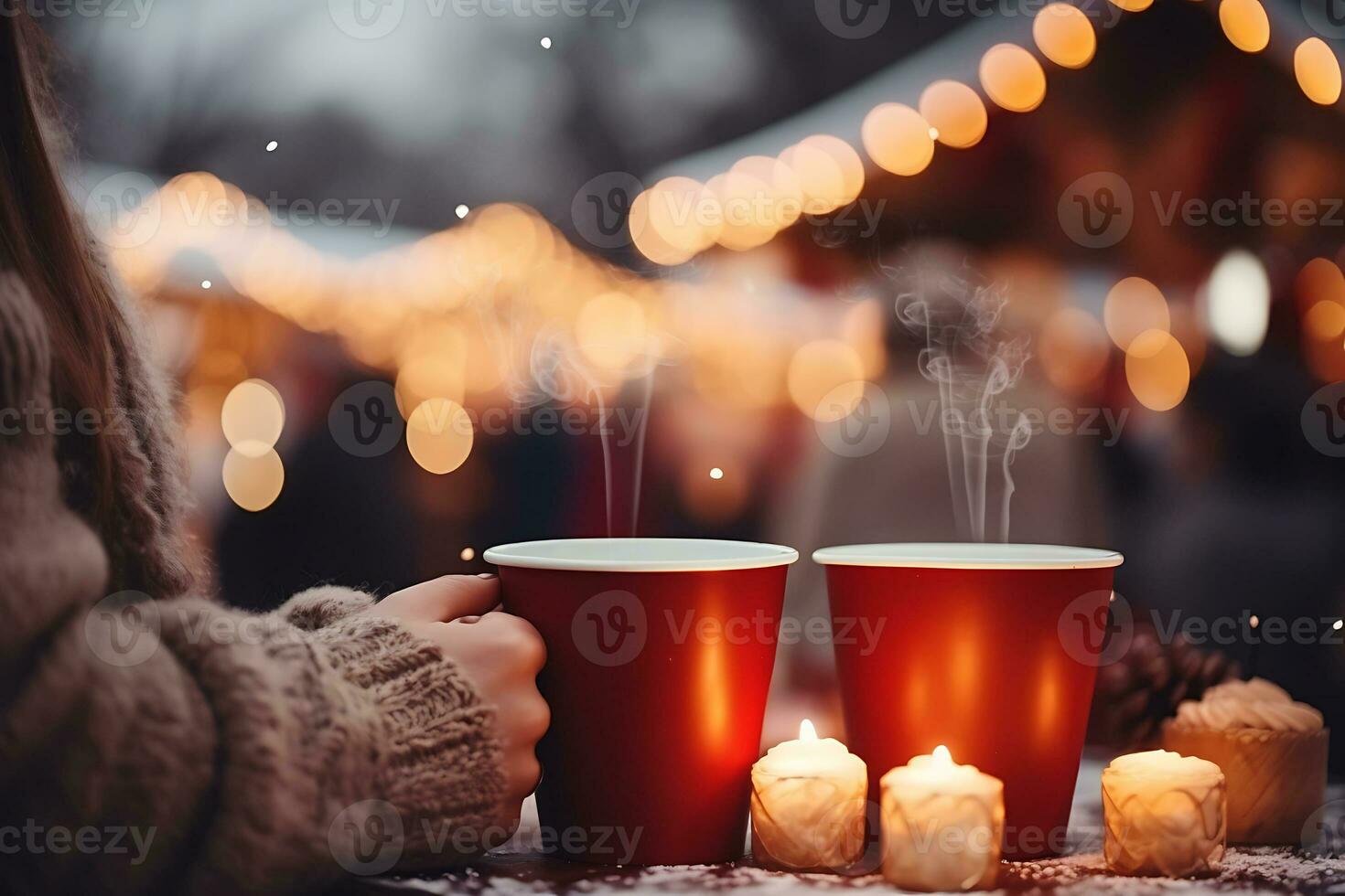 AI generated Two red cups with hot drinks stand on the table against the backdrop of a Christmas market photo