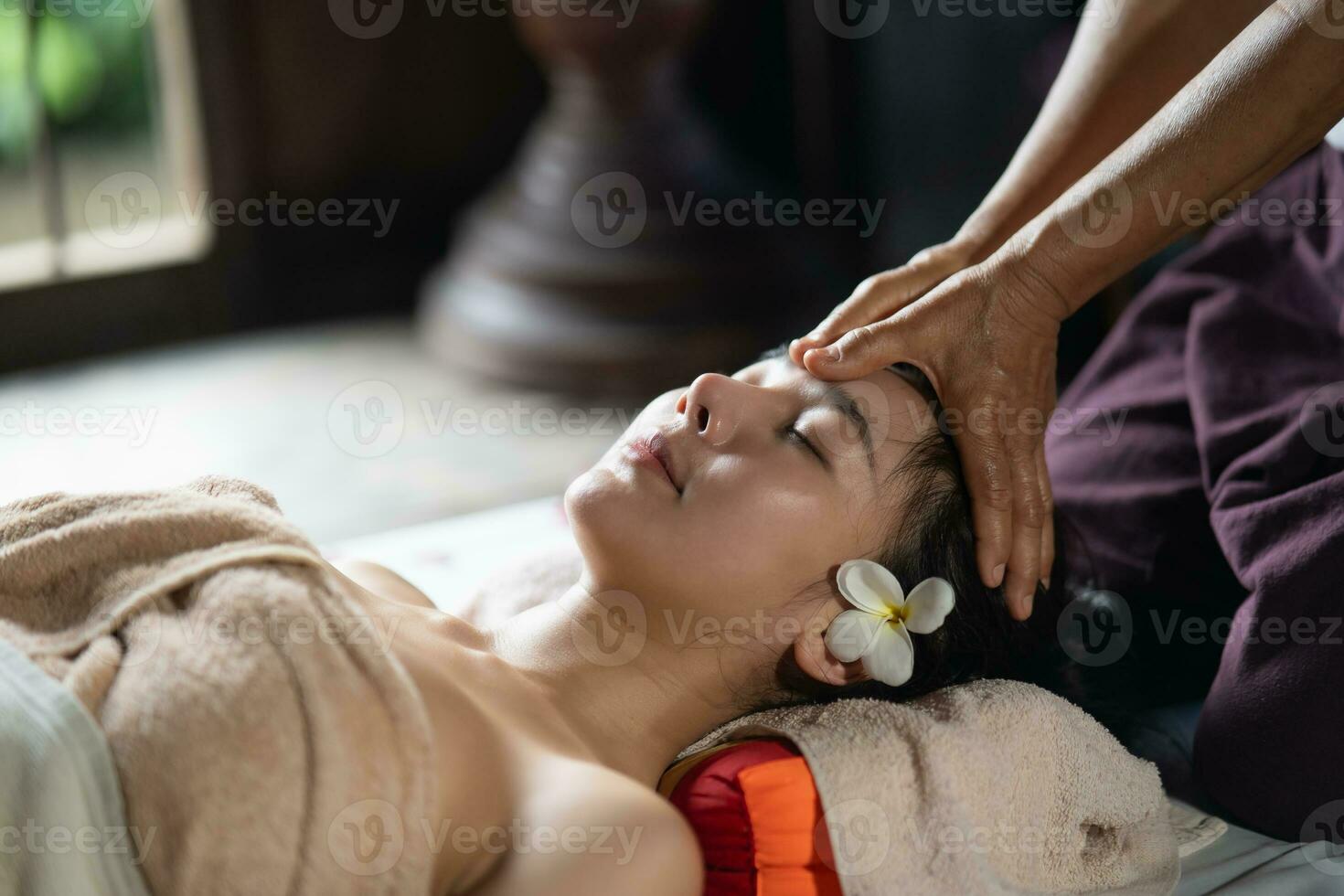 Massage and spa relaxing treatment of office syndrome traditional thai massage style. Asain female masseuse doing massage treat on head pain and stress for office woman tired from work. photo