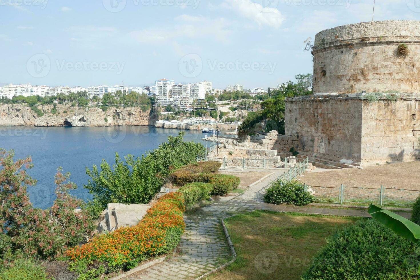 Ancient defensive tower on cliff photo