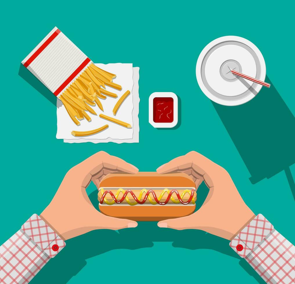 Tasty hotdog, red striped paper glass with drinking straw, french fries in white paper box. Cup of cola with fries and hot dog. Man eating fast food. Top view. Vector illustration in flat style