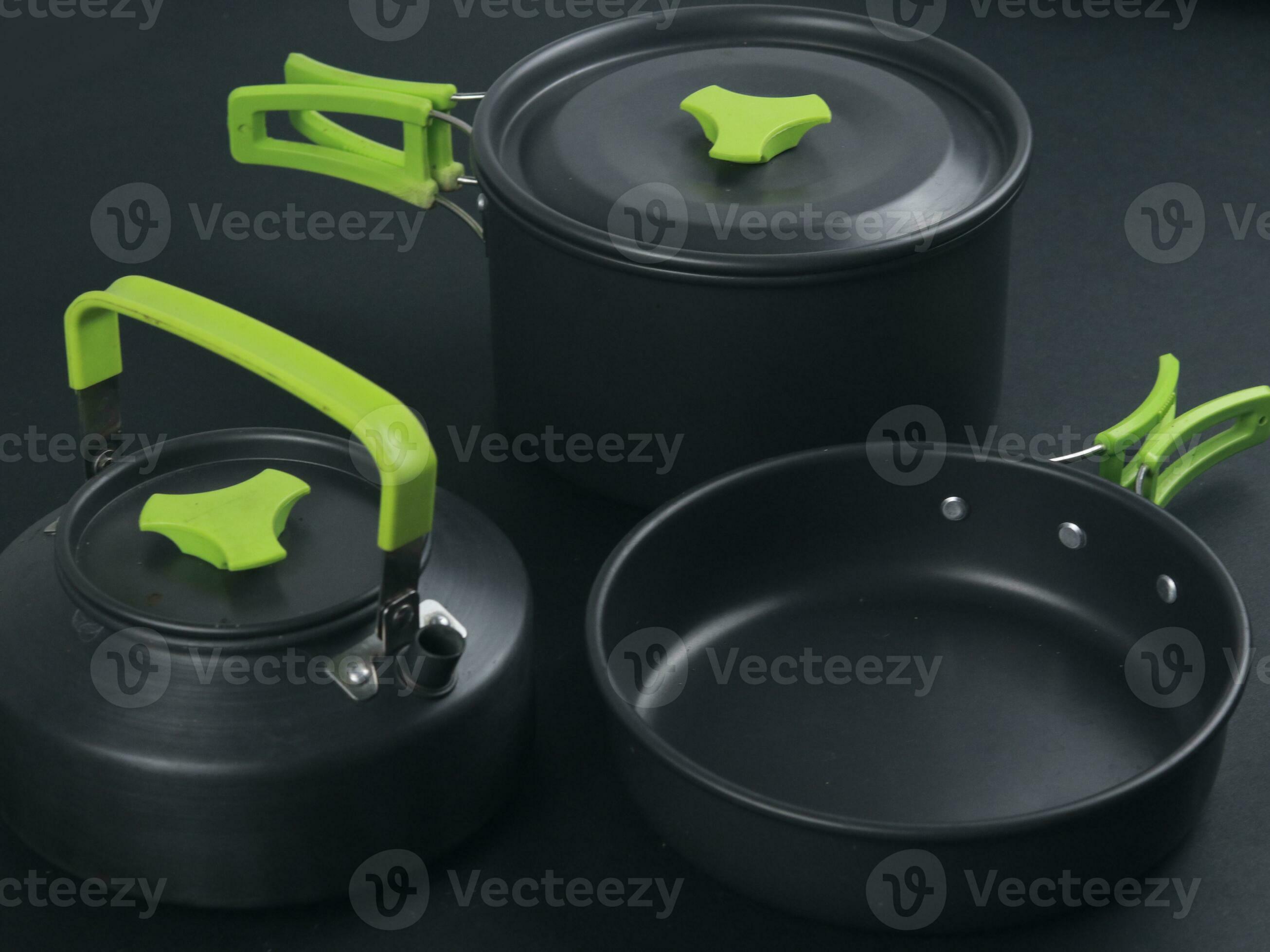 cookware set, antique dinner set isolated on black background, black