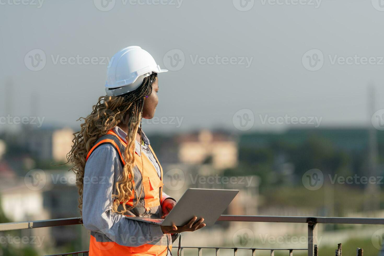 Engineer working on a building site The telephone and internet network signal systems of the construction building are being inspected. photo