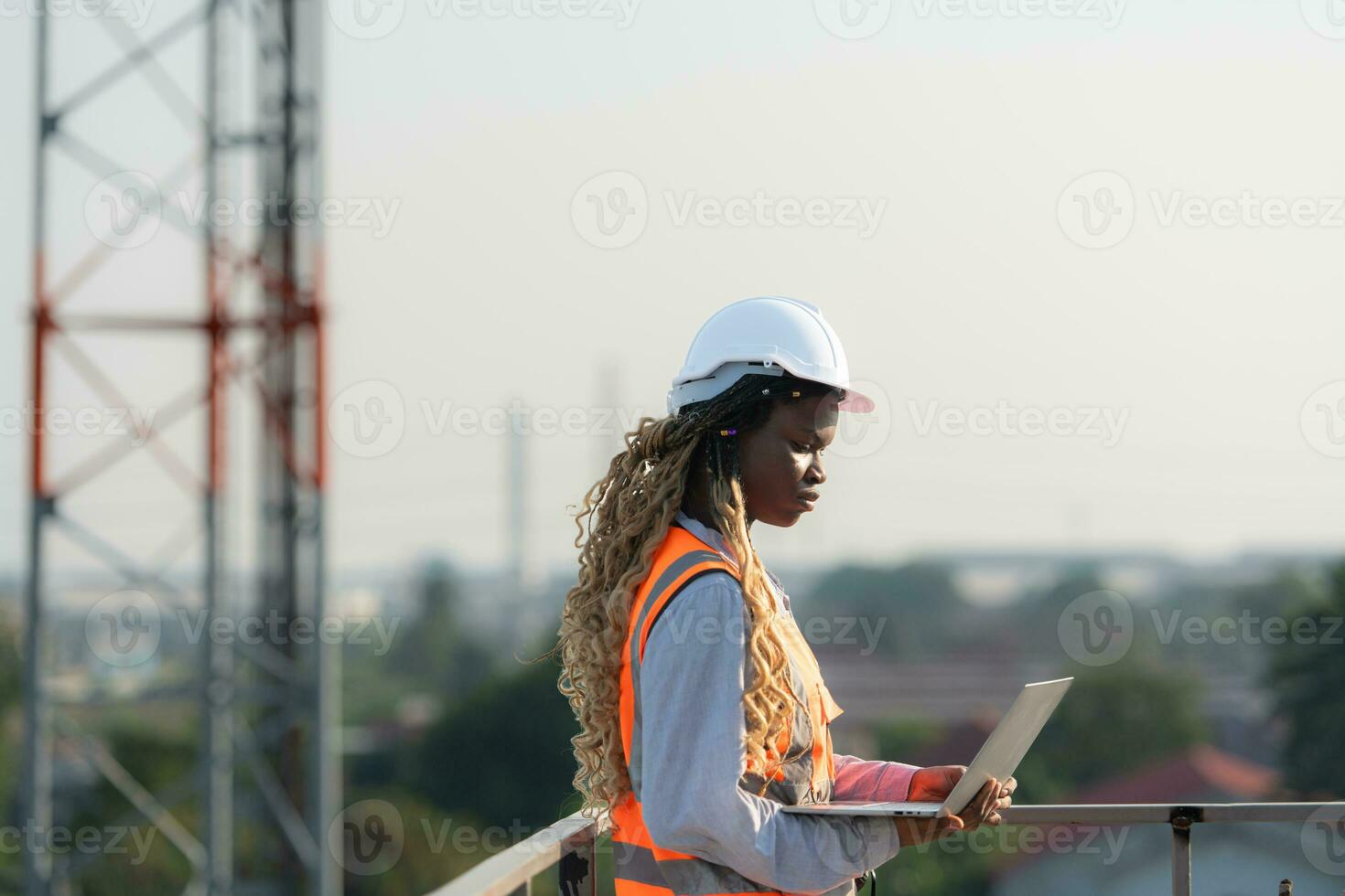 Engineer working on a building site The telephone and internet network signal systems of the construction building are being inspected. photo