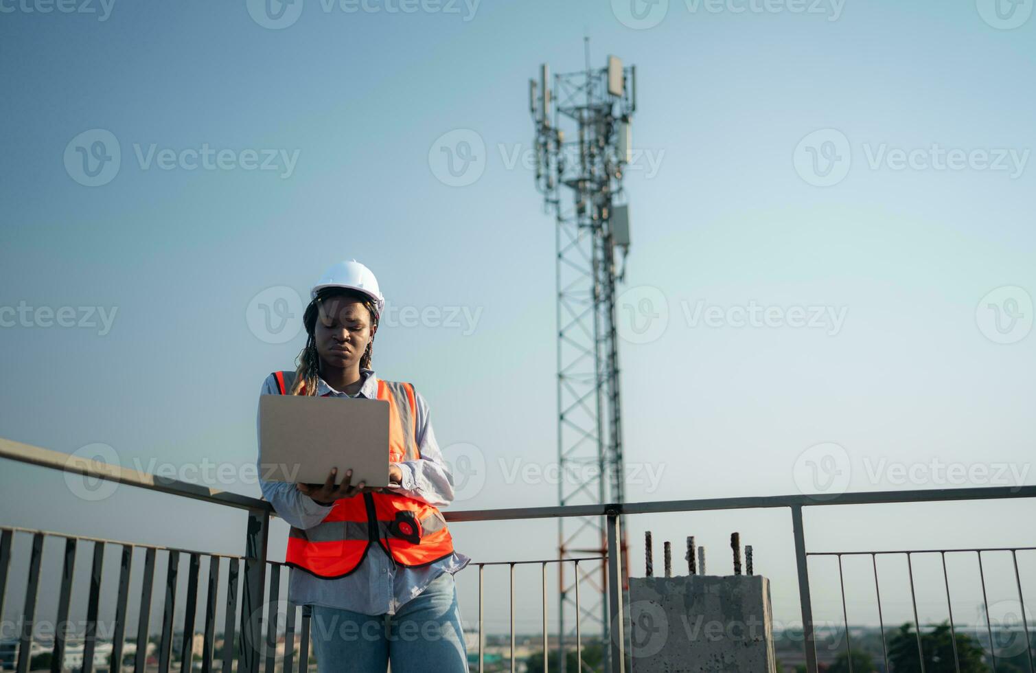 Engineer working on a building site The telephone and internet network signal systems of the construction building are being inspected. photo