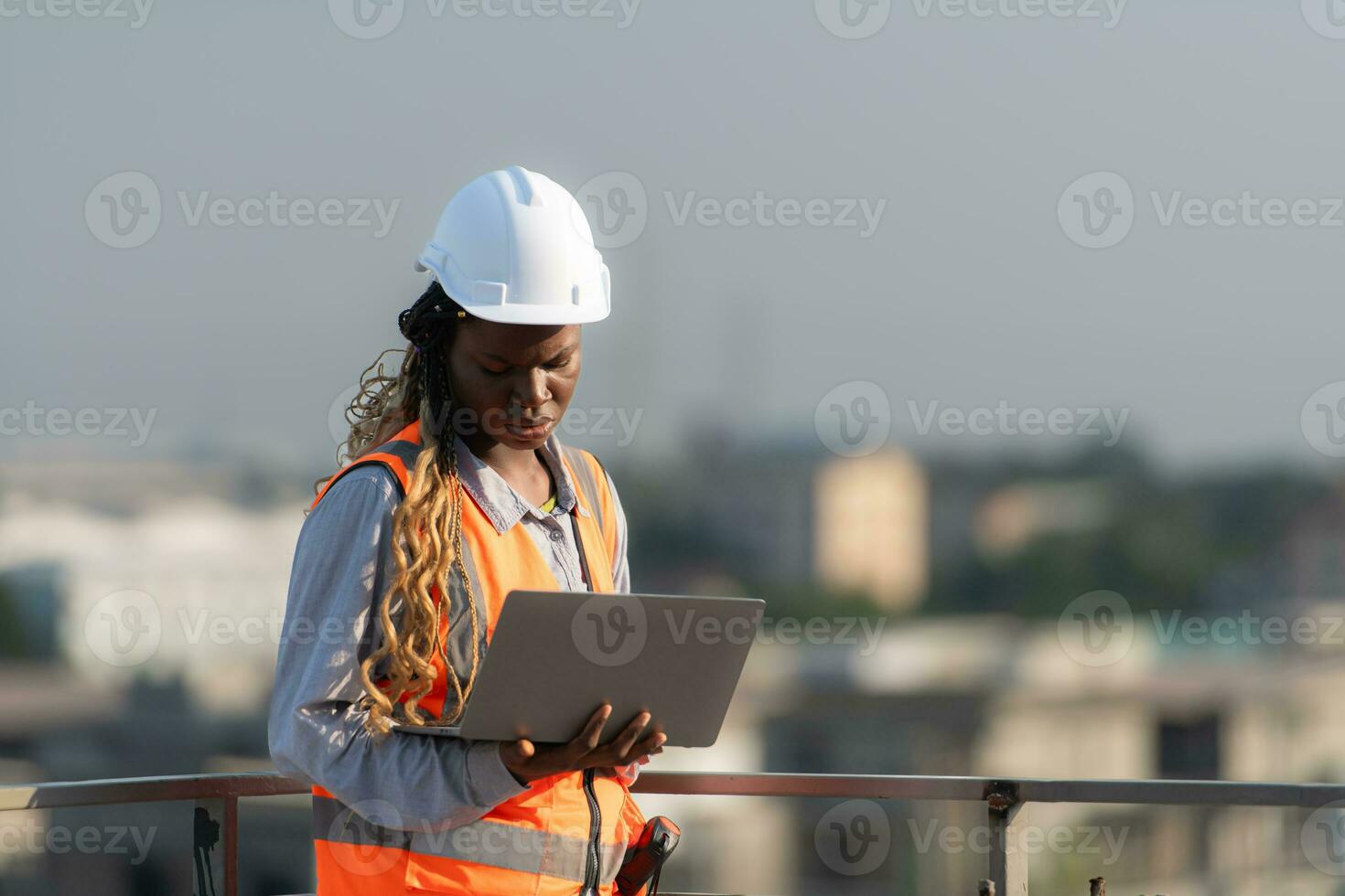 Engineer working on a building site The telephone and internet network signal systems of the construction building are being inspected. photo