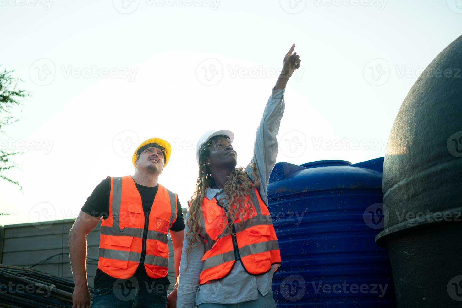 Architect and engineer with experience in multi-story building construction, Inspecting the water system in a construction building. photo