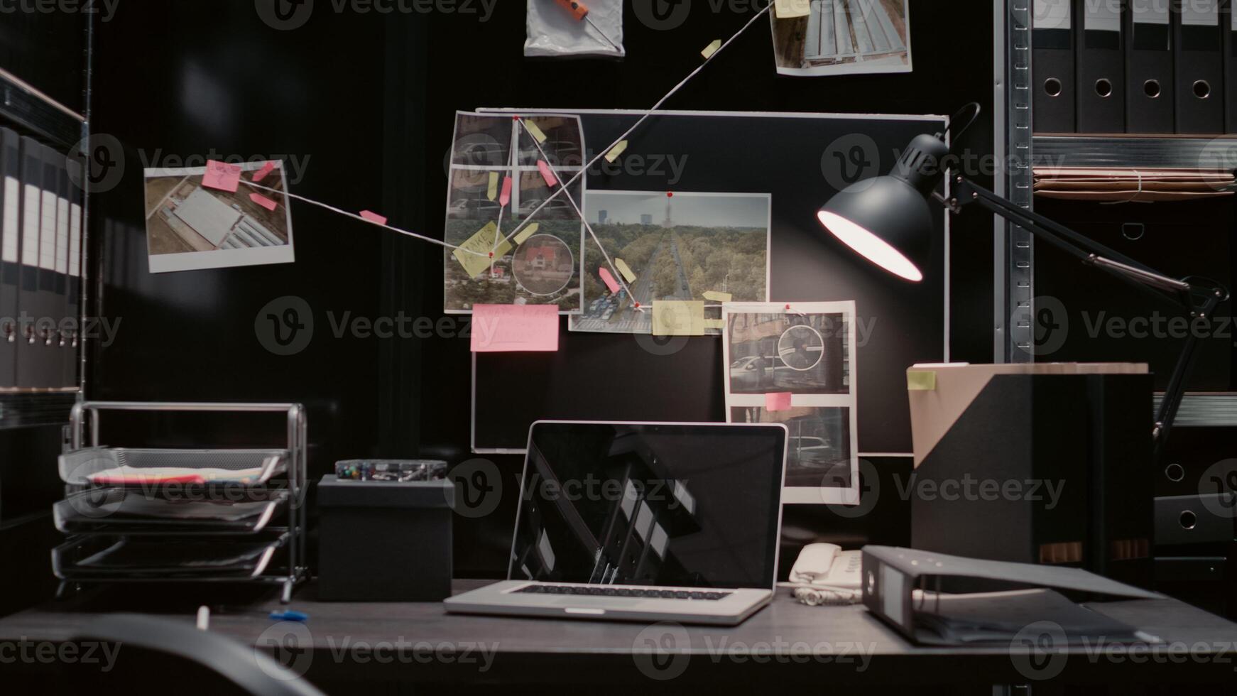 Empty evidence room equipped with detective map and clues on wall board, criminal records papers. Law enforcement agency office office filled with surveillance photos for investigation.