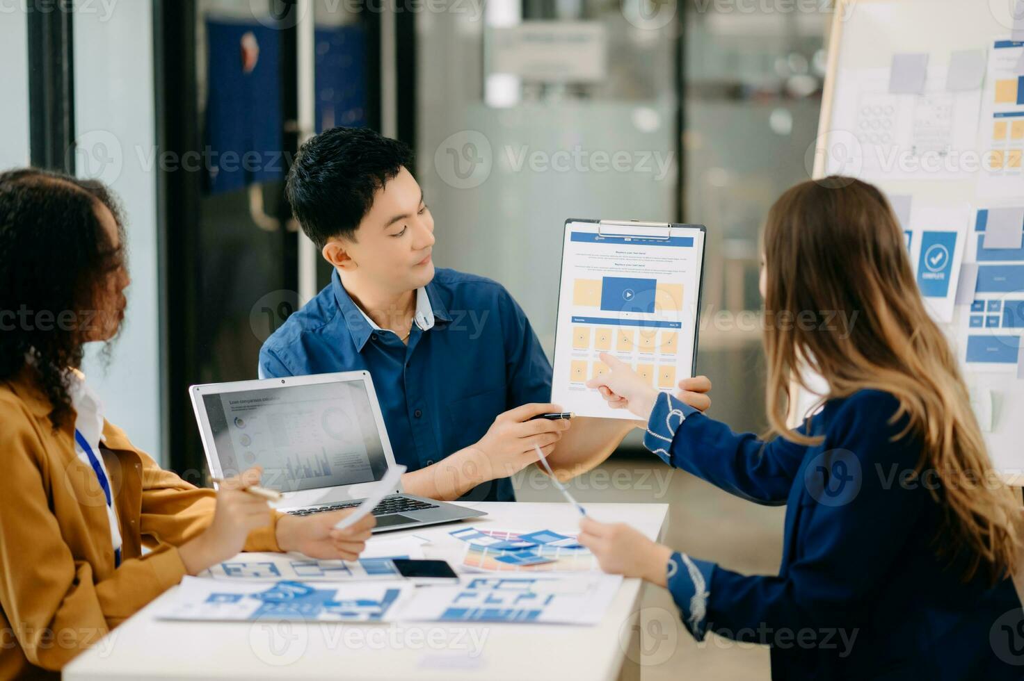 UX developer and ui designer brainstorming about mobile app interface wireframe design with customer breif and color code photo