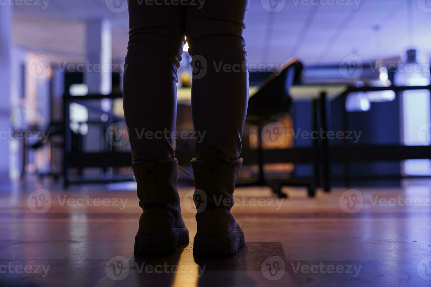 Selective focus of businesswoman leaving startup office late at night after working overtime at financial investment strategy. Executive manager finishing work program. Corporate concept photo