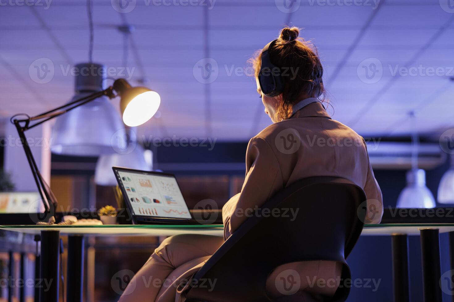 Executive manager checking financial growth report before start planning company investment strategy to increase profit. Busiensswoman analyzing marketing graphs, working overhours in startup office photo