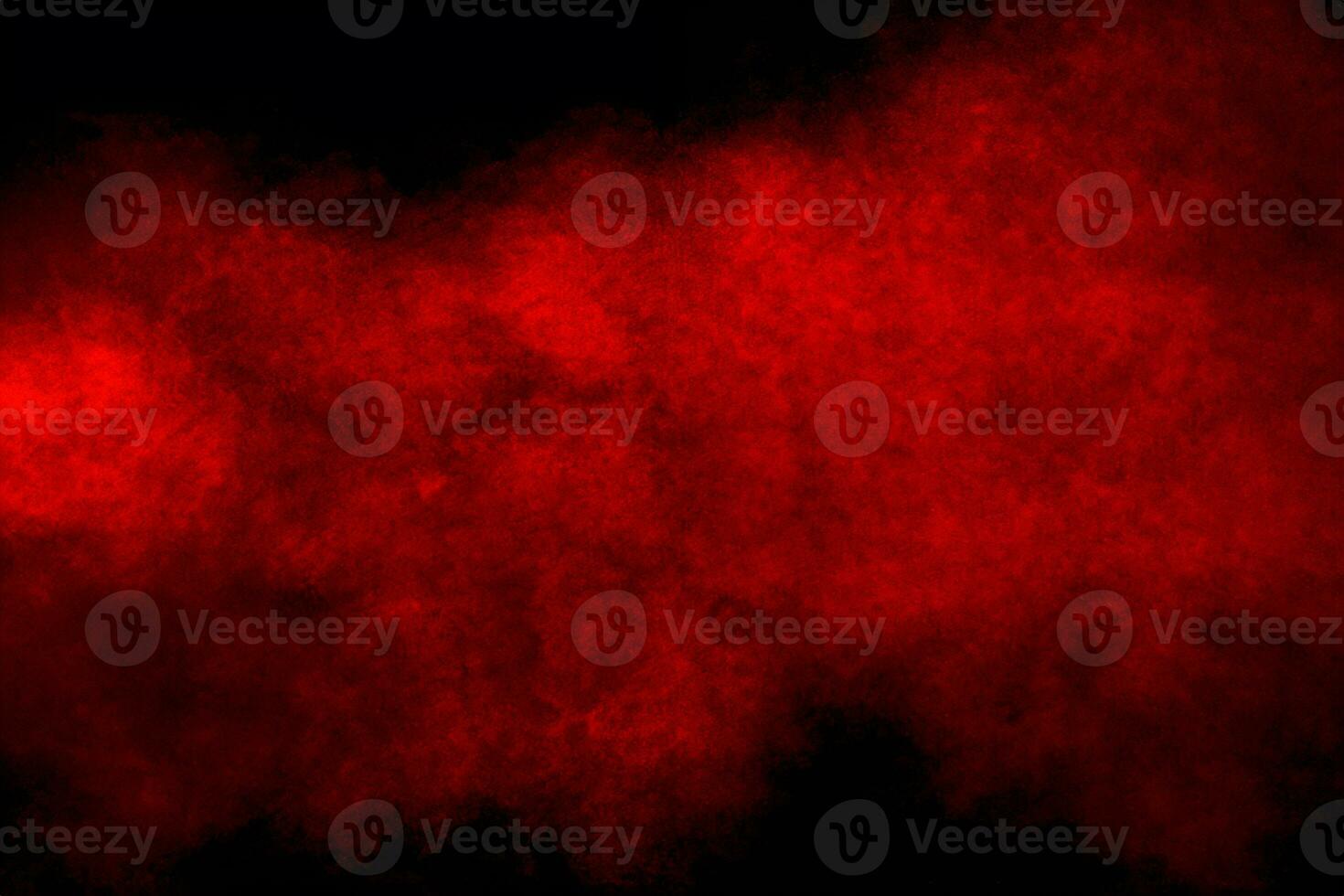 Red powder explosion cloud on black background. photo