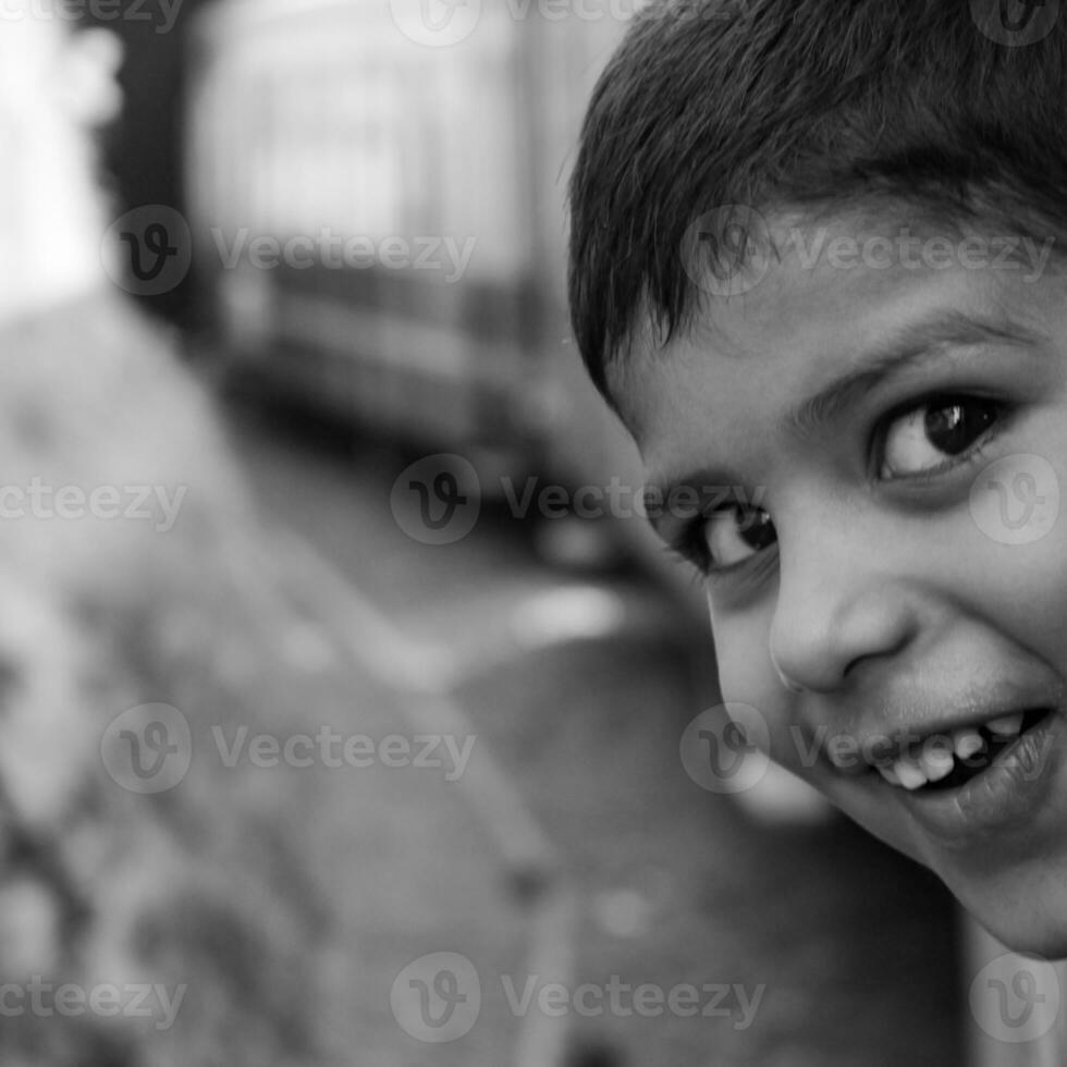 Little Boy travelling in Toy Train moving on mountain slopes, beautiful view, one side mountain, one side valley moving on railway to the hill, among green natural forest. Toy train Shimla photo