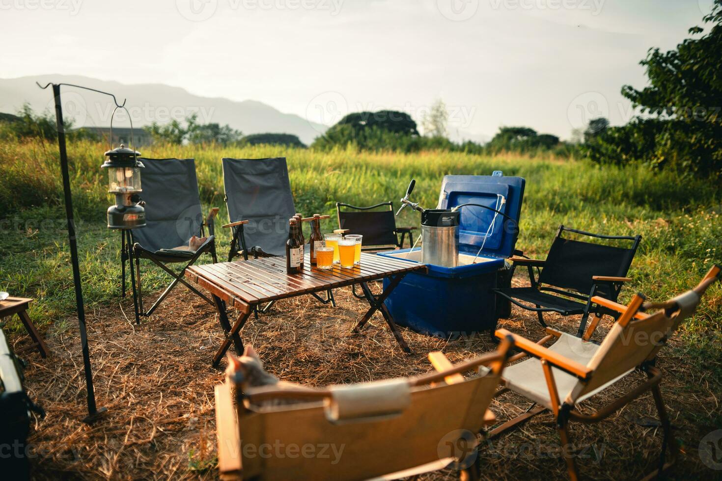 Beer on the table and camping party,hands toasting in beer, photo