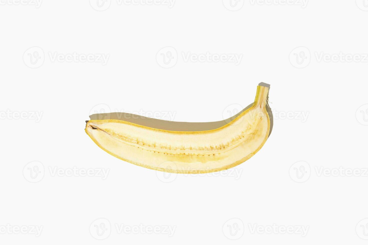 Minimalistic banana on white isolated background. Creative concept of smile. photo