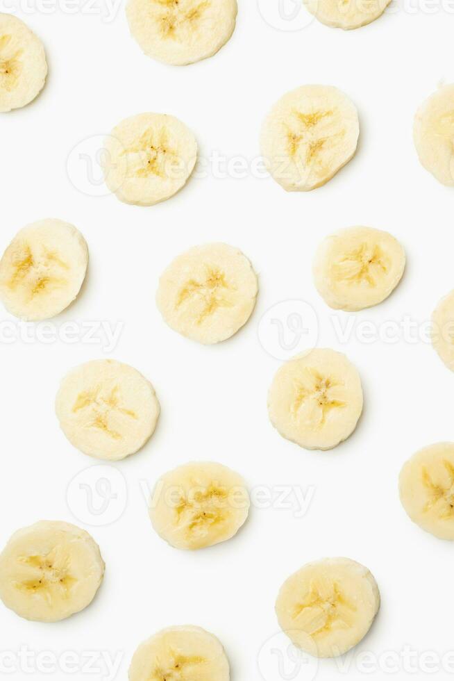 Pattern of sliced banana on white background. photo
