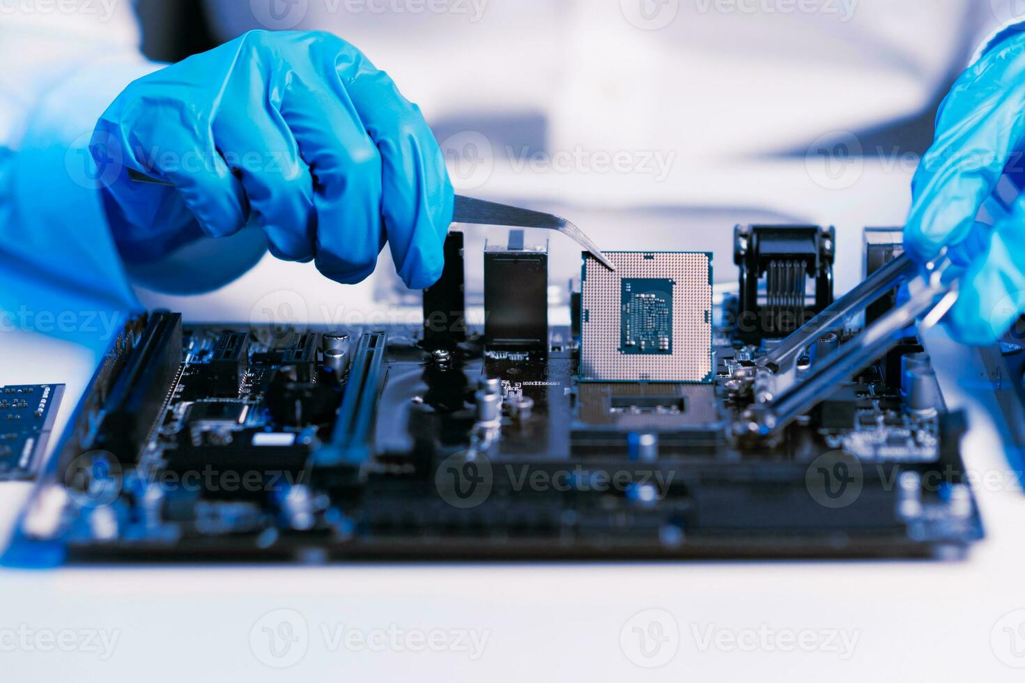 The technician repairing the motherboard in the lab with copy space. the concept of computer hardware, mobile phone, electronic, repairing, upgrade photo