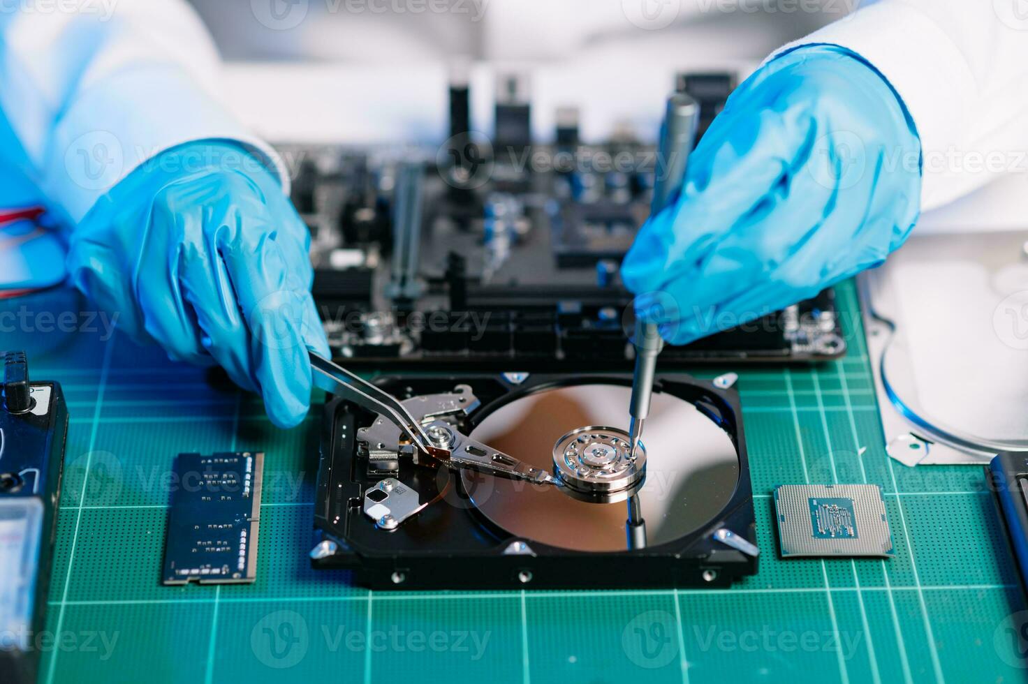 The technician repairing the motherboard in the lab with copy space. the concept of computer hardware, mobile phone, electronic, repairing, upgrade photo