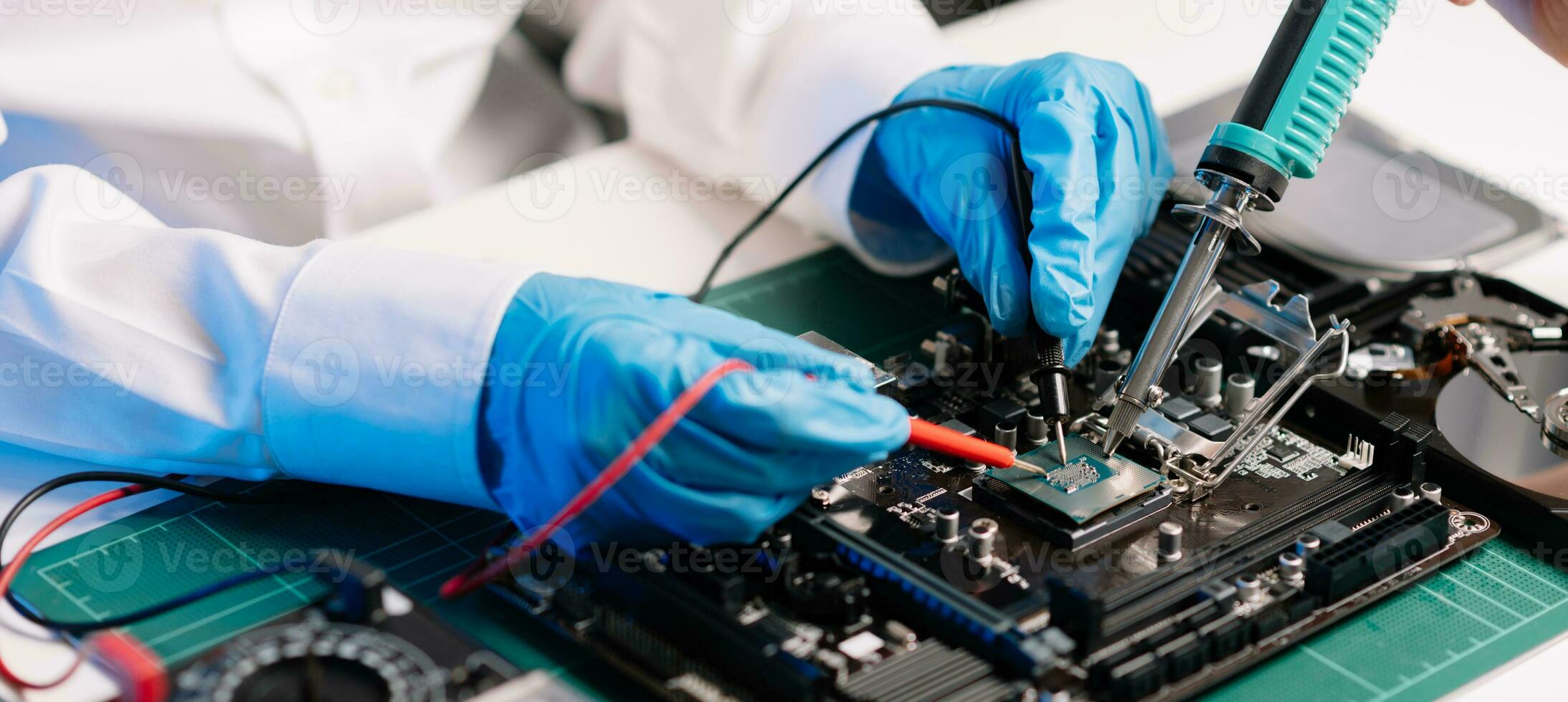 The technician repairing the motherboard in the lab with copy space. the concept of computer hardware, mobile phone, electronic, repairing, upgrade photo