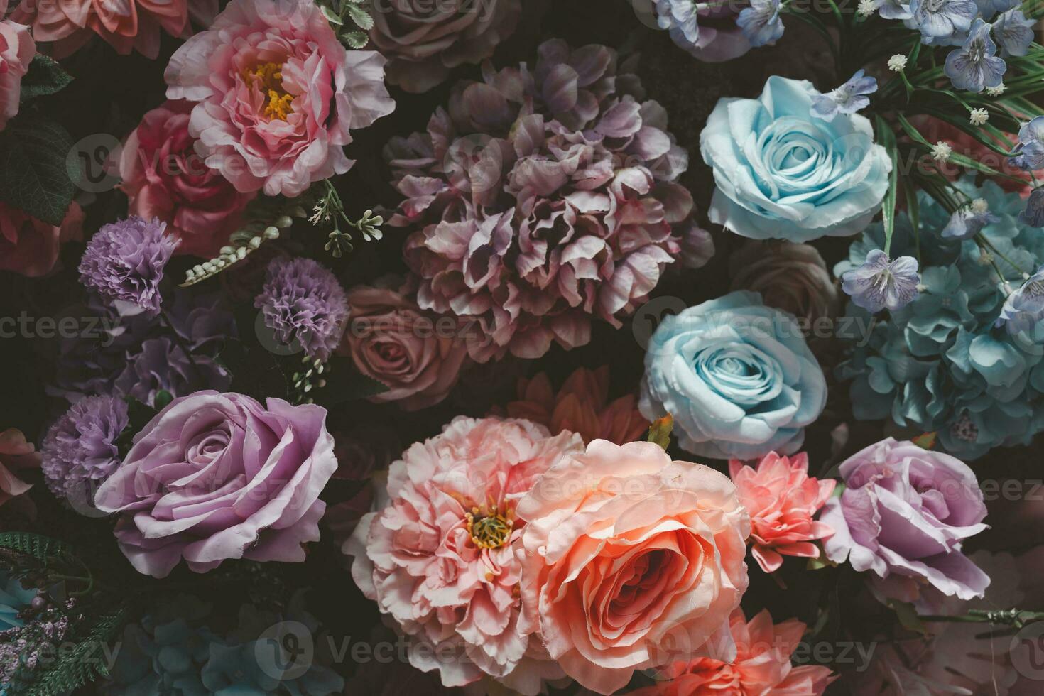 Artificial flowers background. Close up photo