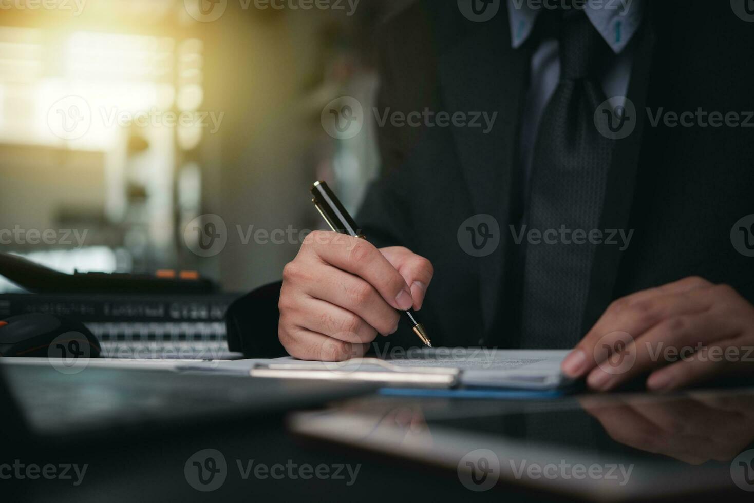 Business person Writing contract law and paper work for business and finance, write document, complete job application forms, contract real estate and insurance concept. photo