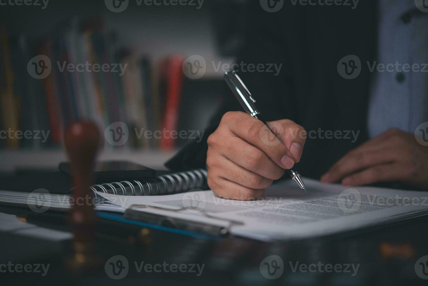 Business person Writing contract law and paper work for business and finance, write document, complete job application forms, contract real estate and insurance concept. photo